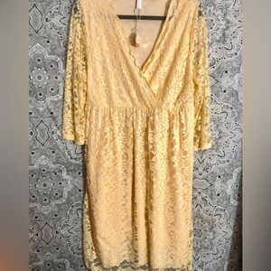 Beautiful peach colored stretch lace maternity wrap dress